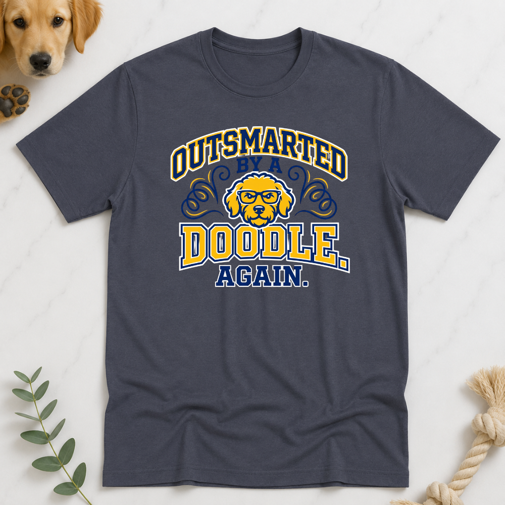 Charcoal t-shirt with 'Outsmarted by a Doodle Again' graphic on a light background